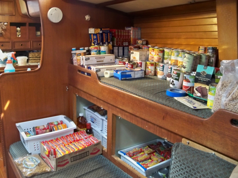 Storing provisions aboard our sailboat, Mosaic, as we prepared to leave the marina for the pnw cruising season amid a global pandemic