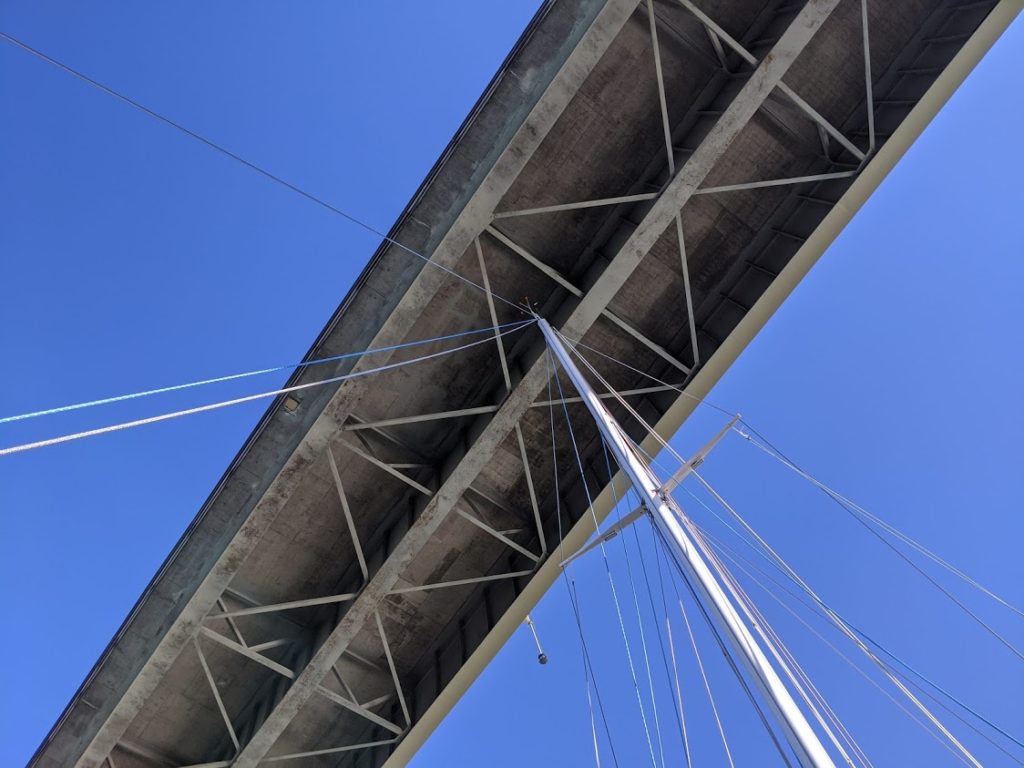 Looking up at the top of our sailboat's mast underneath the bridge across the Swinomish Channel