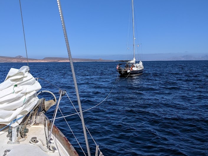 Cruising Meraki towing Mosaic Voyage into safe harbor after their engine broke down near La Paz, Mexico
